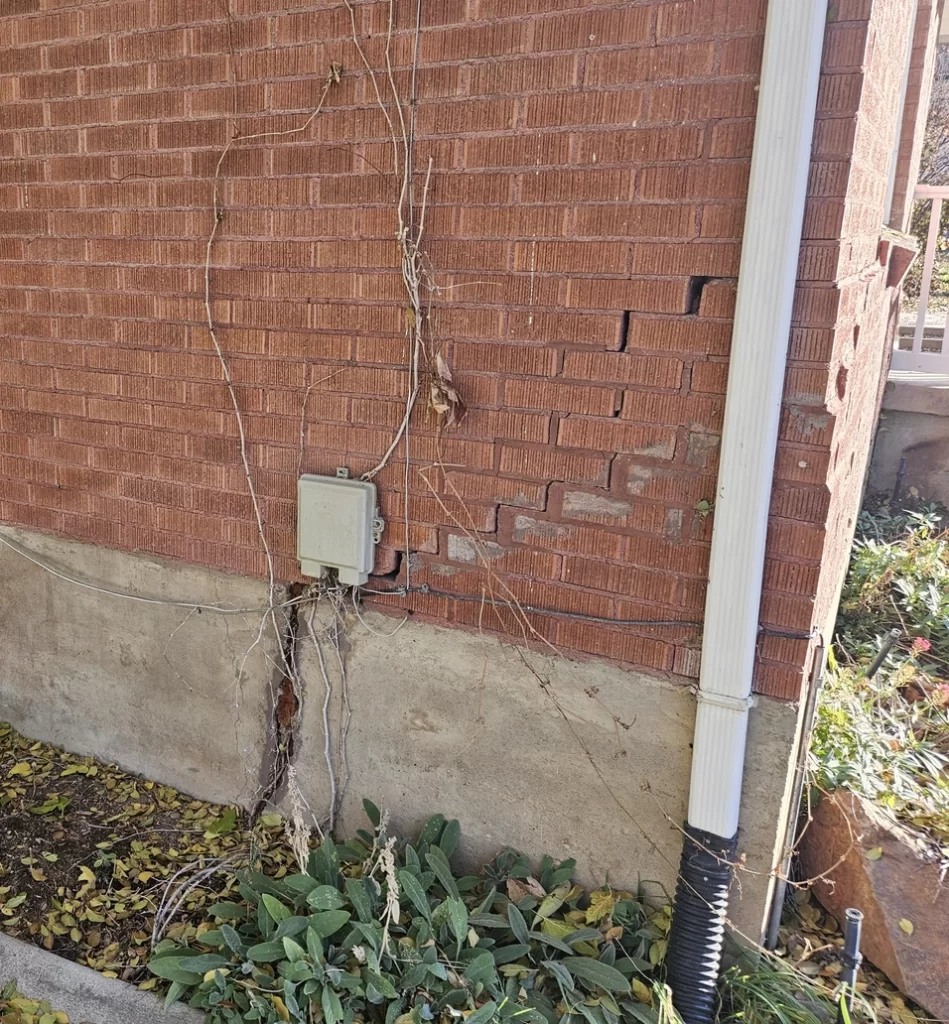 Helical piers installed beneath a Utah home to show why your foundation needs immediate stabilization